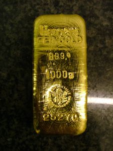 Featured is a photo of a gold bar aka gold bullion.